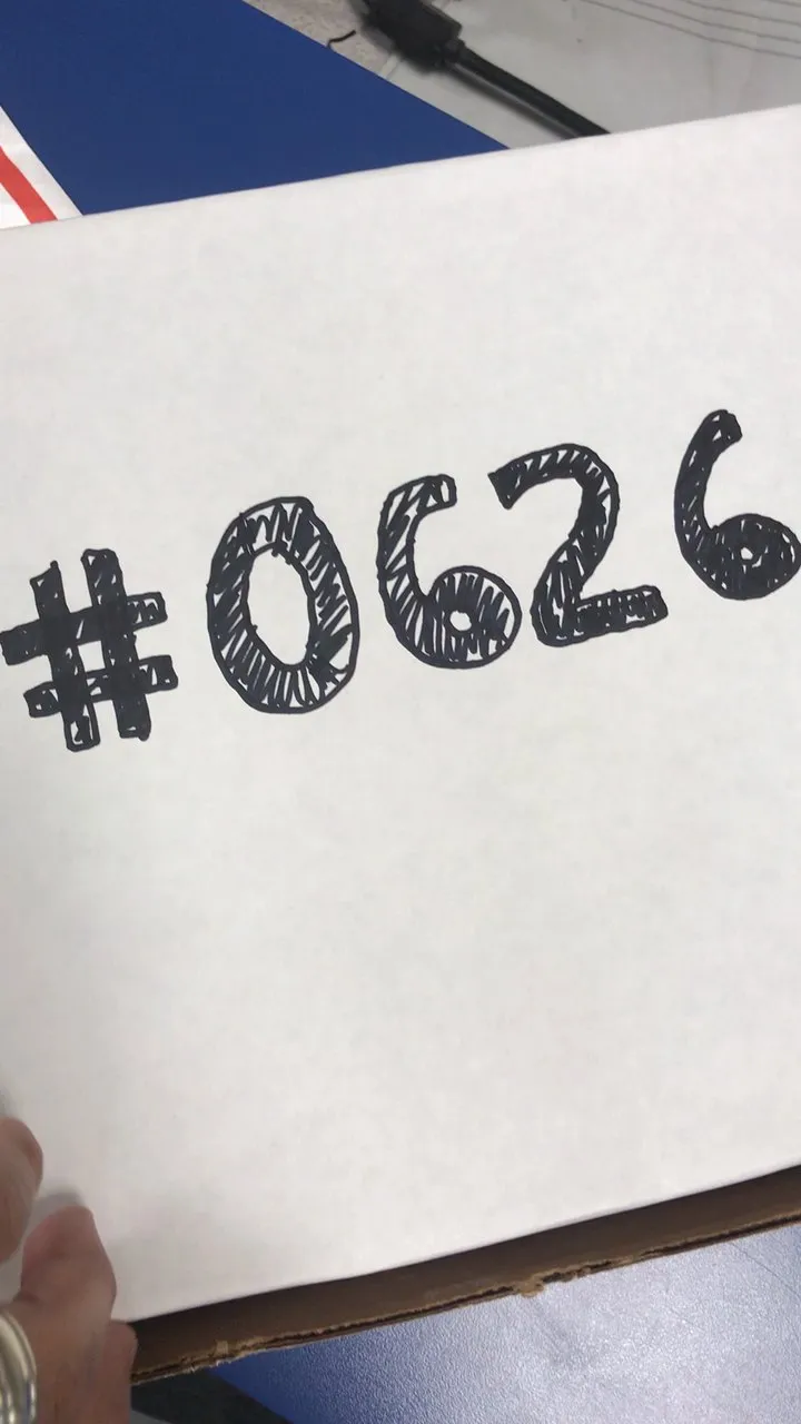 A box with #0626 written in marker